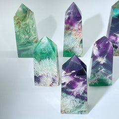 Natural fluorite crystal tower with snowflake patterns