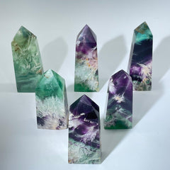 Snowflake fluorite tower with polished crystal point