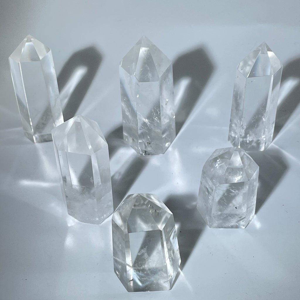 Transparent clear quartz points displayed for healing use